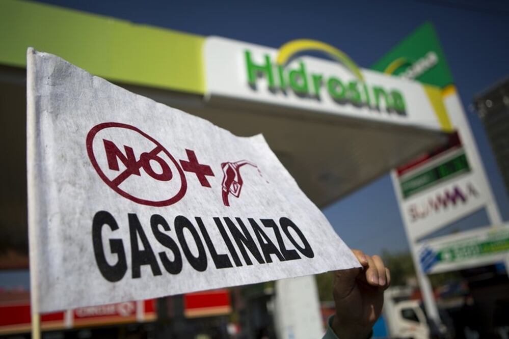Protesters are blocking roads and stations across Mexico to protest a government price deregulation that sent the price of fuel up by as much as 20 percent over the weekend. (AP Photo/Rebecca Blackwell)
