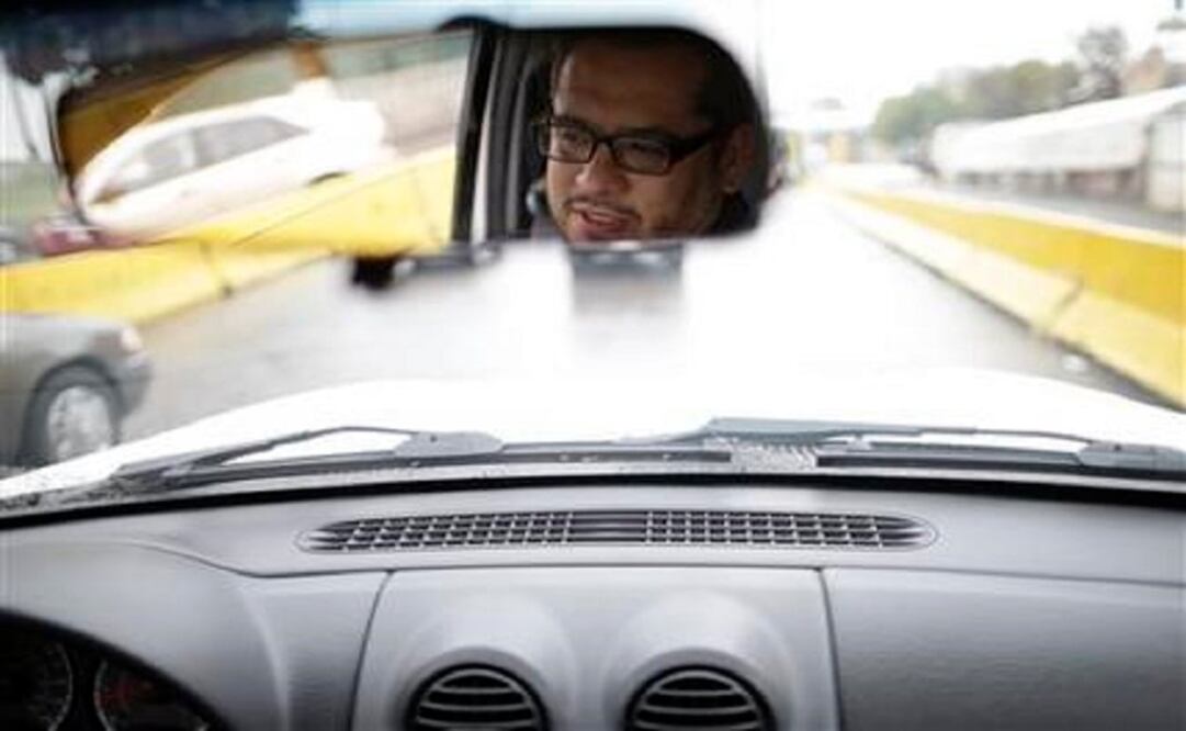 In this Dec. 3, 2014 file picture, Rene Peralta, 46, waits in his car to enter the United States from Tijuana, Mexico through the San Ysidro port of entry. (Photo: AP)