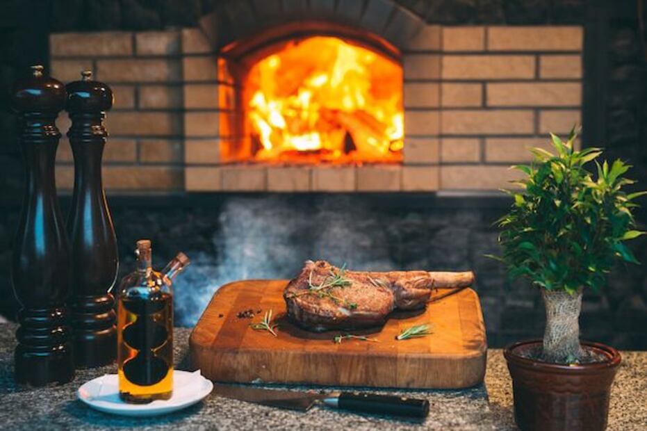Disfruta del asado sin sufrir por el humo. Fuente: Freepik.