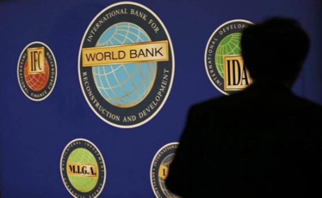 A man is silhouetted against the logo of the World Bank Photo:Kim Kyung Hoon/Reuters