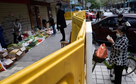 Vendedores de Wuhan trata de volver a la normalidad tras brote de Covid-19