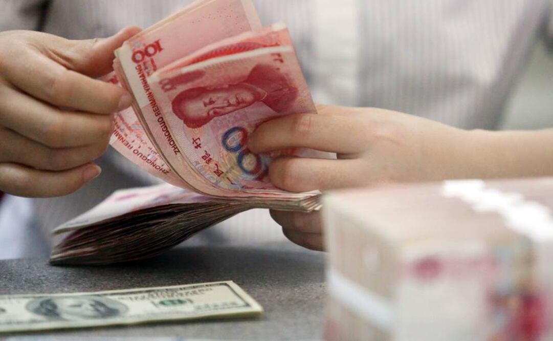 La tasa de paridad central del yuan se devaluó el miércoles hasta 6.3306 contra el dólar. Foto: Xinhua