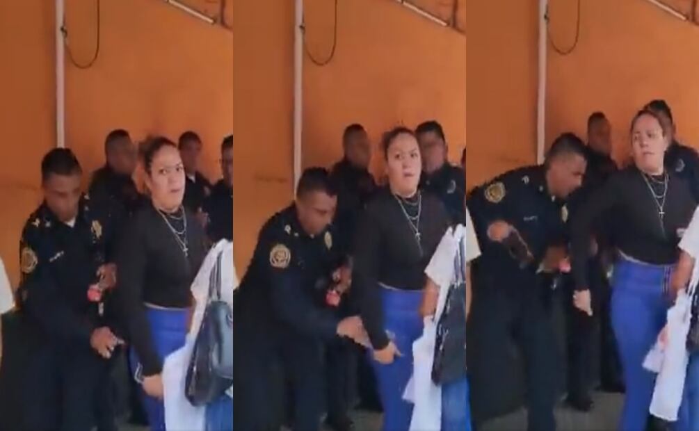 Policía arrebata celular a una mujer. Foto: Especial