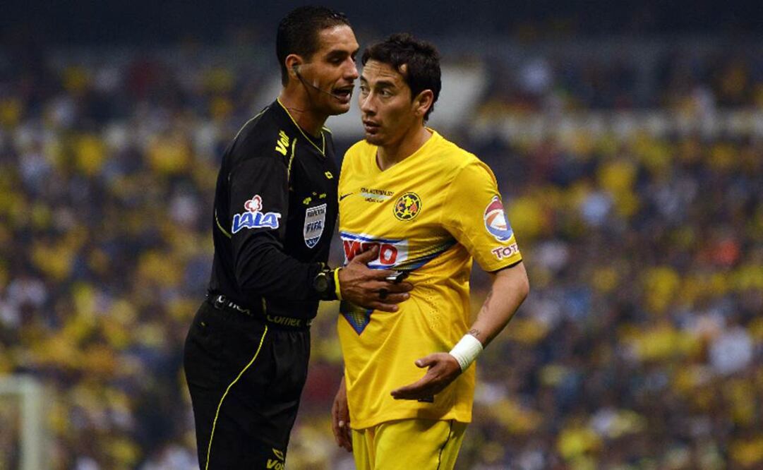 García Orozco calma a Rubens Sambueza. Archivo 