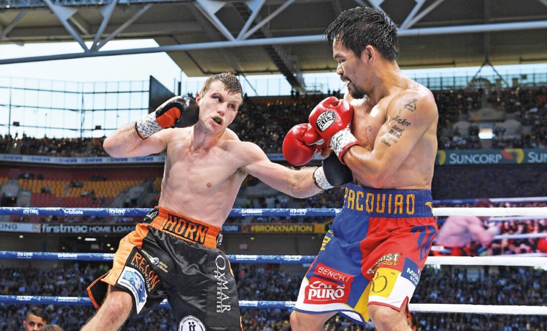 Pacman rehusó hablar de los jueces y aceptó el resultado del combate; el filipino terminó con el rostro ensangrentado en suelo del rival. (DAVE HUNT. EFE)