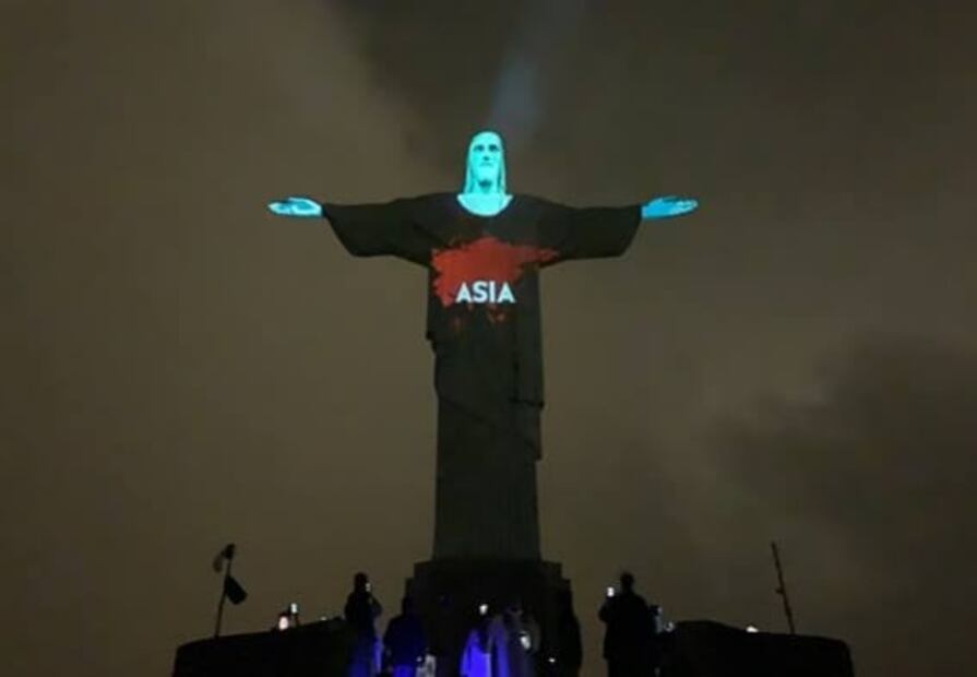 Cristo Redentor se ilumina con las banderas del mundo por coronavirus