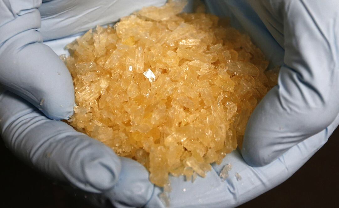 A member of the German Criminal Investigation Division (BKA) displays Crystal Methamphetamine (Crystal Meth) during a news conference at the BKA office in Wiesbaden November 13, 2014 - Ralph Orlowski/Reuters