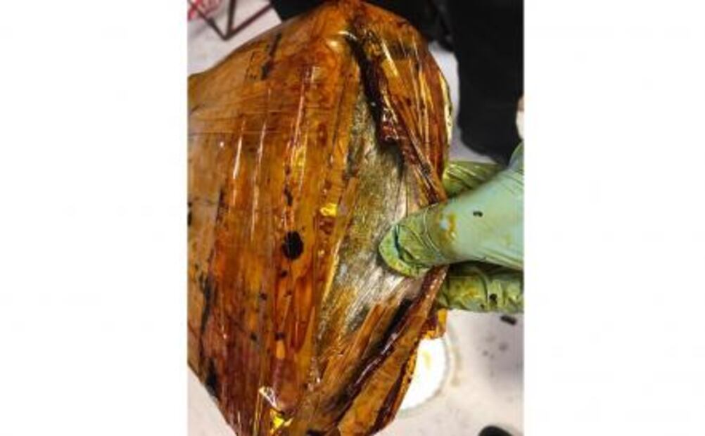 Hallan 3 kilos de marihuana en cubeta con mole en Veracruz