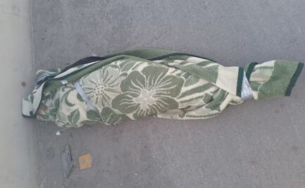 Hallan cadáver de una mujer envuelto en una cobija en carretera rumbo al AIFA