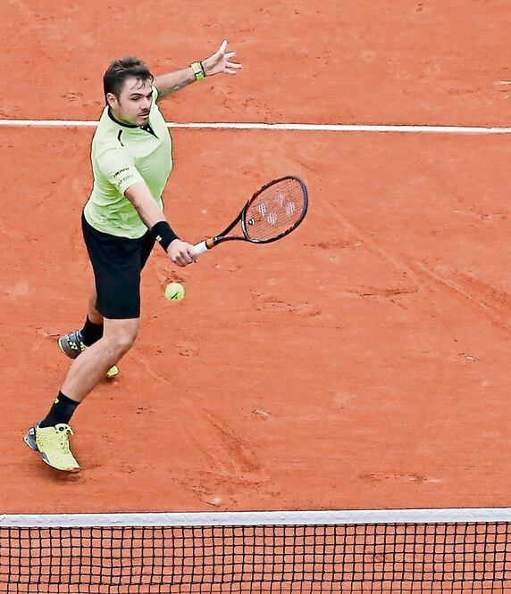 El suizo se impuso 7-6 (5), 6-7 (7), 6-3 y 6-2 sobre Viktor Troicki (JACKY NAEGELEN. REUTERS)