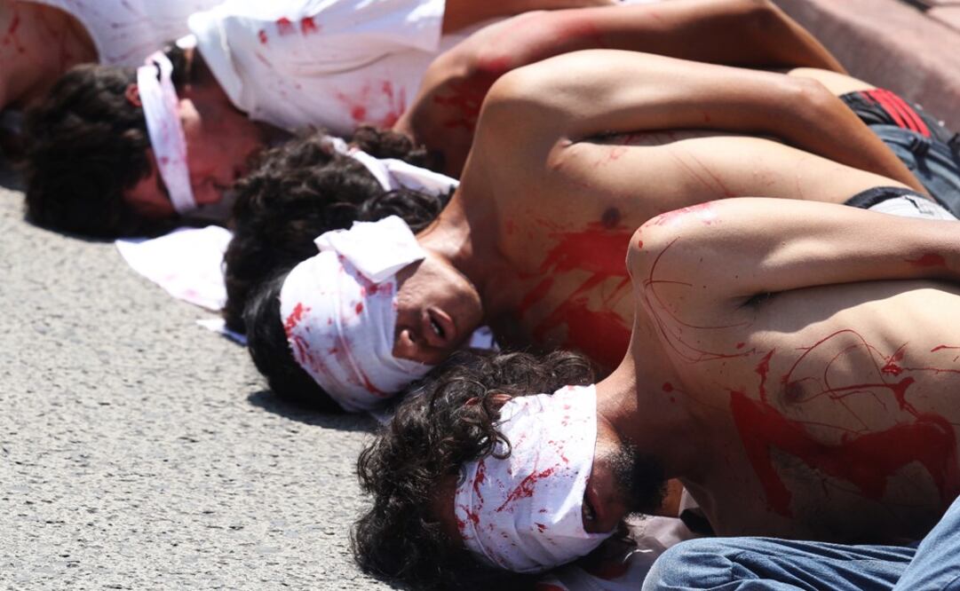 A performance representing the 43 missing students – Photo: Ulises Ruiz Basurto/EFE