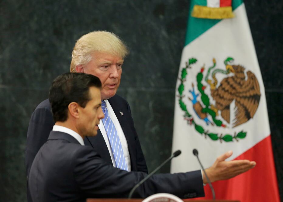 Donald Trump seen in this file photo after President Enrique Peña Nieto extended an invitation to the then Republican presidential nominee, causing public outrage in Mexico.
