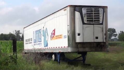Sepultan a 21 de los cuerpos almacenados en "tráiler de la muerte"