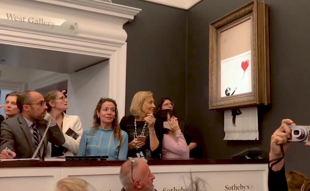 Momento justo en el que “Girl With Balloon” comienza a triturarse. Foto: Especial