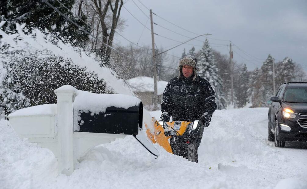 HAMBURG, NEW YORK - DECEMBER 01: Tom Szczerbacki begins the task of removing the near two feet of lake effect snow from his home on December 1, 2024 in Hamburg, New York. The North Eastern storm that closed a ninety mile stretch of The New York State Thruway and snarled holiday traffic across the country dumped more than four feet of snow around Buffalo and its southern suburbs and is expected to continue throughout the weekend.   John Normile/Getty Images/AFP (Photo by John Normile / GETTY IMAGES NORTH AMERICA / Getty Images via AFP)