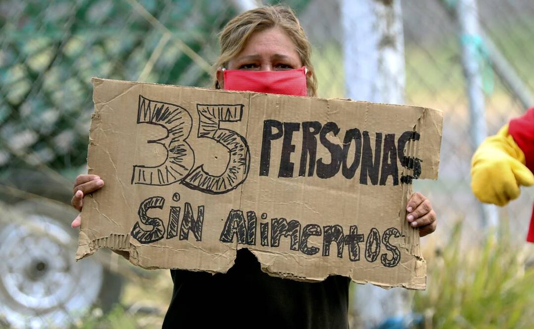 Una mujer pide ayuda para comer en Tegucigalpa, Honduras. Foto: EFE