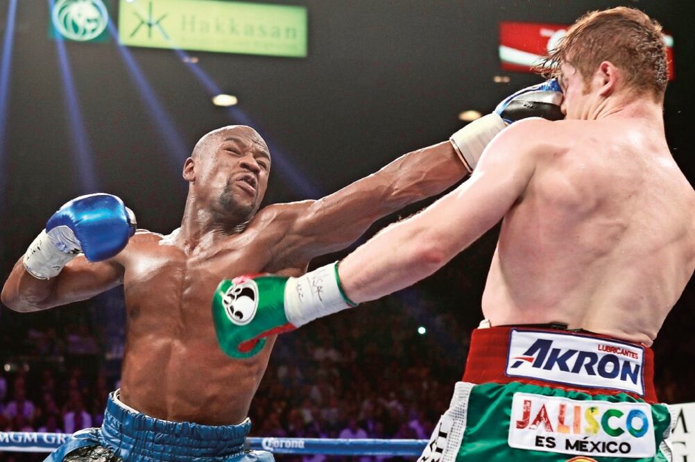 En 2013 Floyd Mayweather hizo ver mal a Saúl Álvarez (FOTOS. ARCHIVO. EL UNIVERSAL)